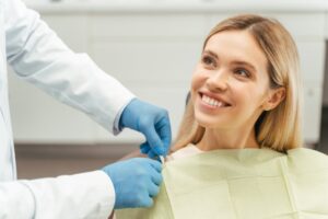 smiling woman in the dentist’s chair