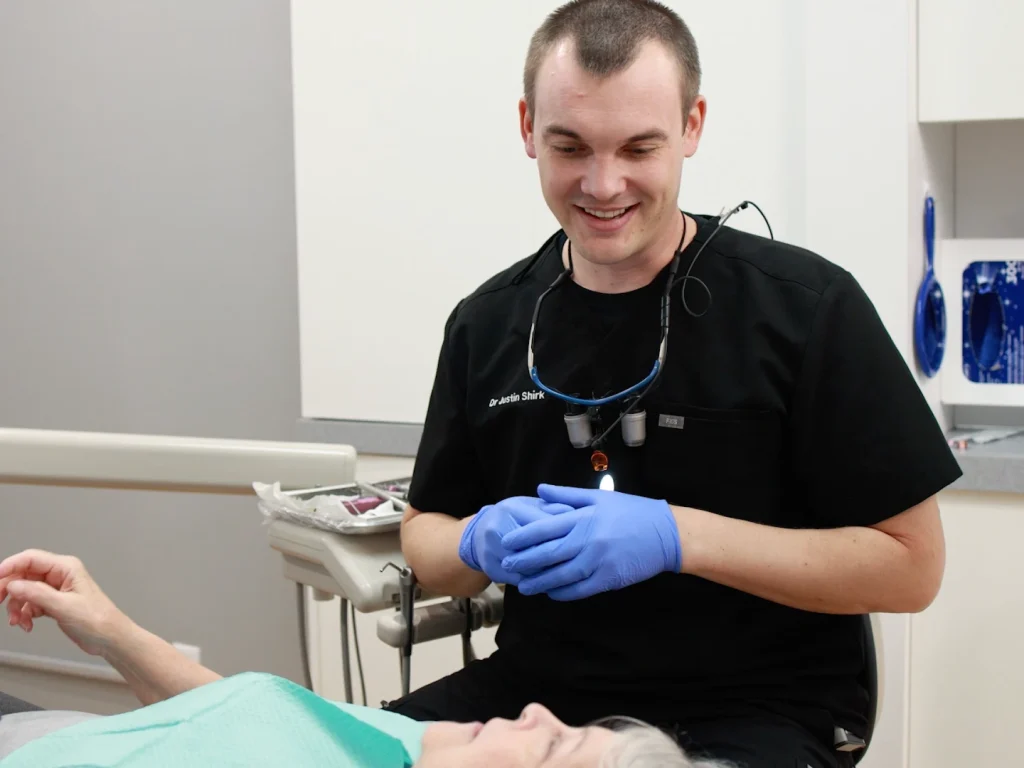 Dr. Shirk smiling with a patient